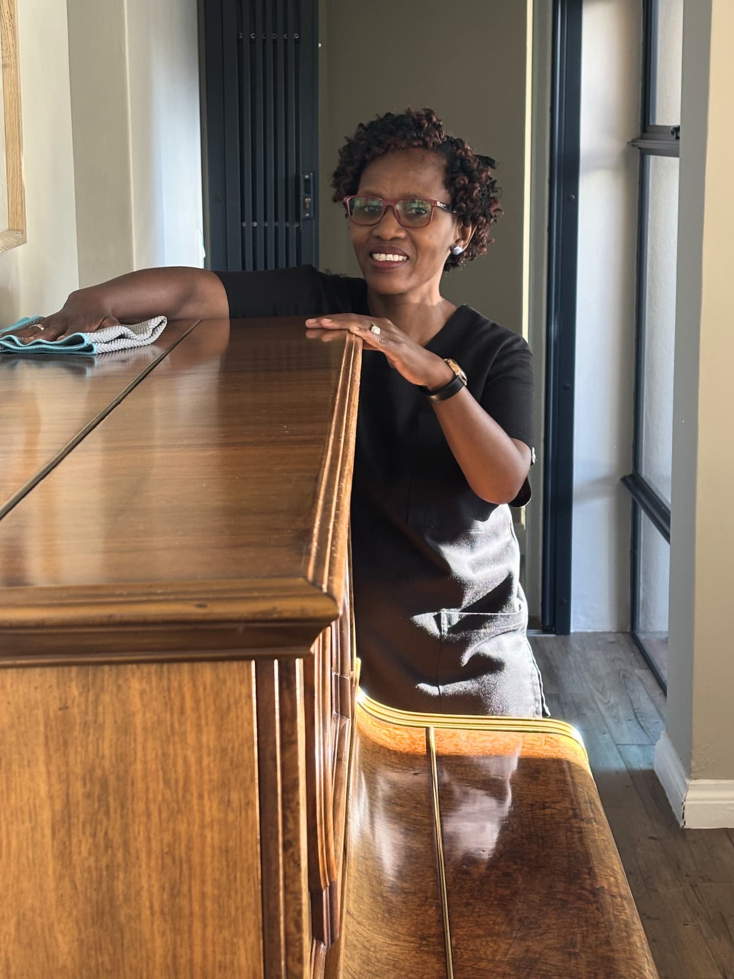 Cleaner preparing supplies before starting a home cleaning service